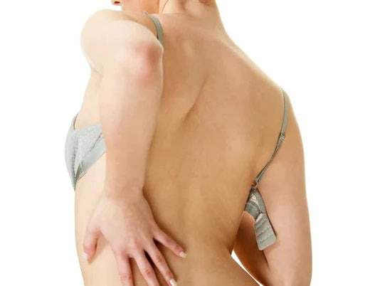 Is there a connection between large breasts and upper back pain?